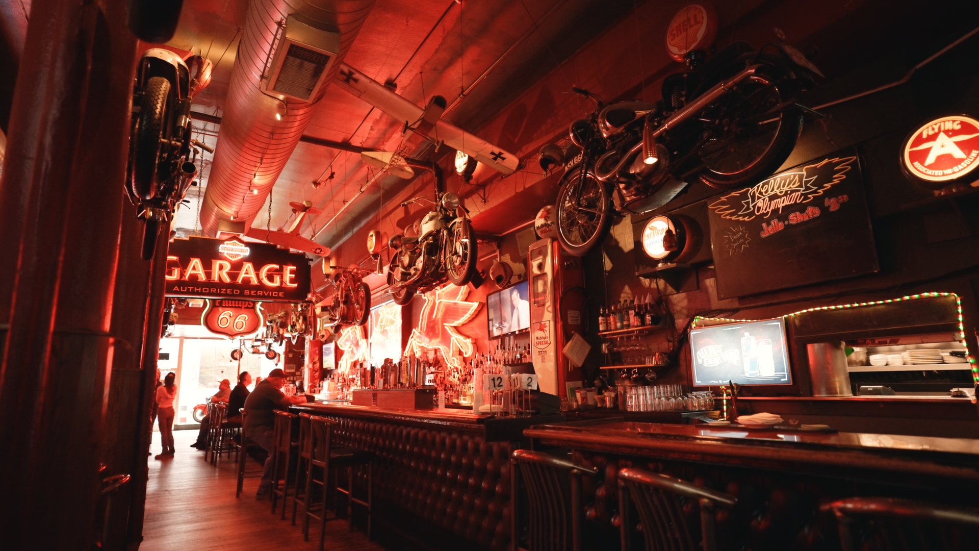 Inside Kelly's Olympian: neon signs, vintage motorcycles and the long wooden bar